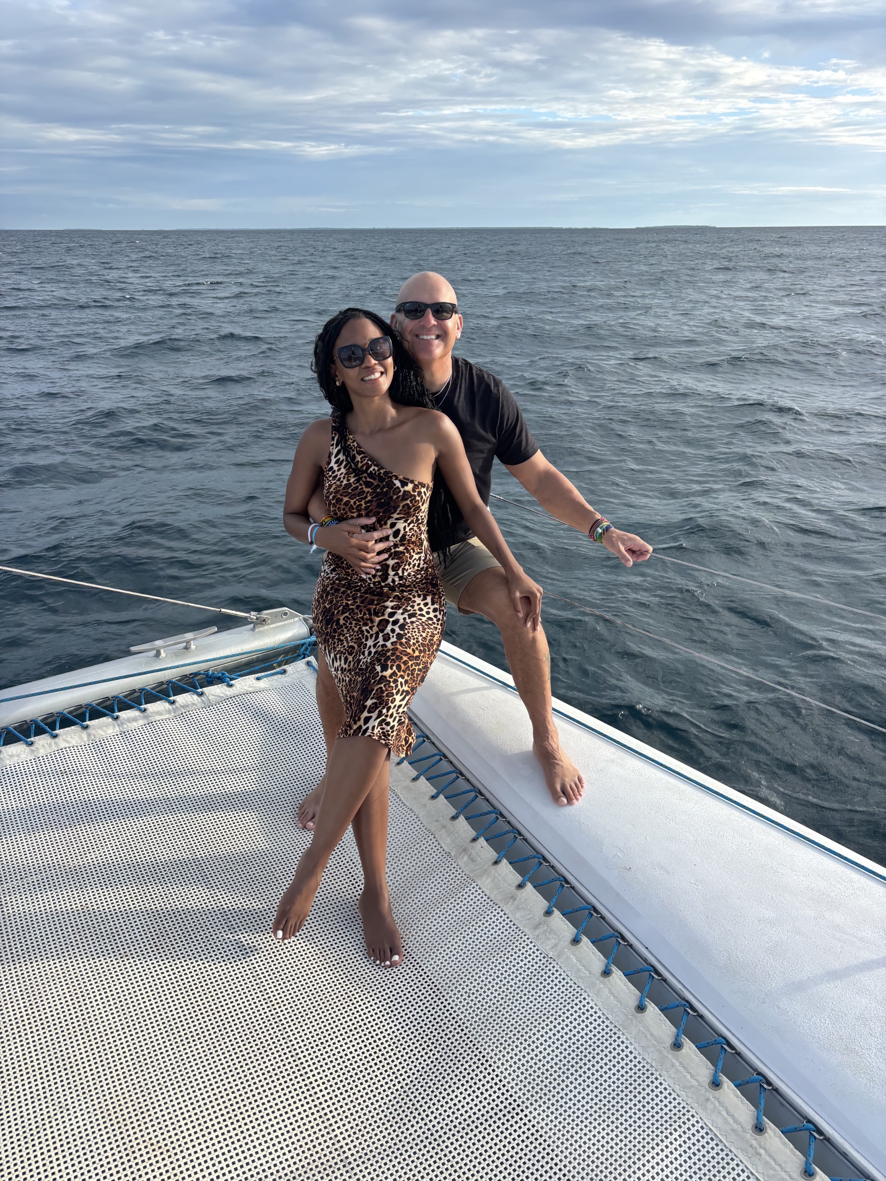 Ronald and Thembeka smiling together on a boat